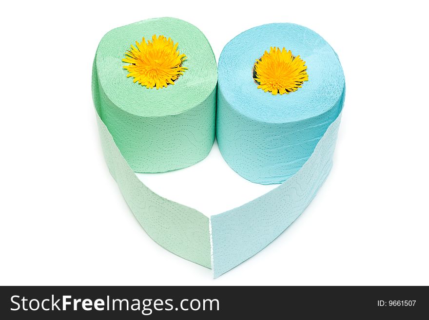 Two rolls of the toilet paper in the manner of heart with yellow colour