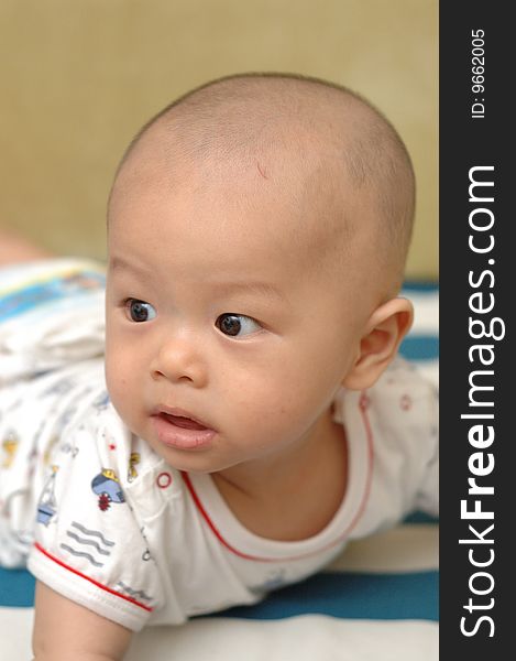 It is a cute chinese baby, isolated. he is 6 months. It is a cute chinese baby, isolated. he is 6 months.