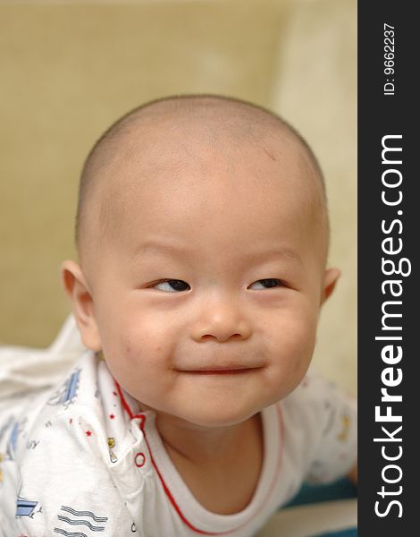 It is a cute chinese baby, isolated. he is 6 months. It is a cute chinese baby, isolated. he is 6 months.