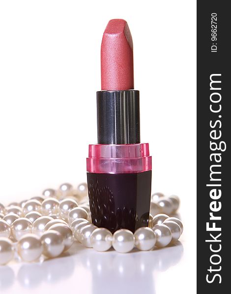 A pink lipstick with perl on white