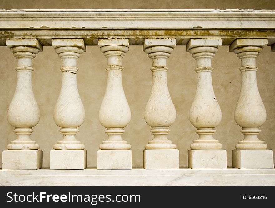 A row of pillars decorate a church - shot in Italy