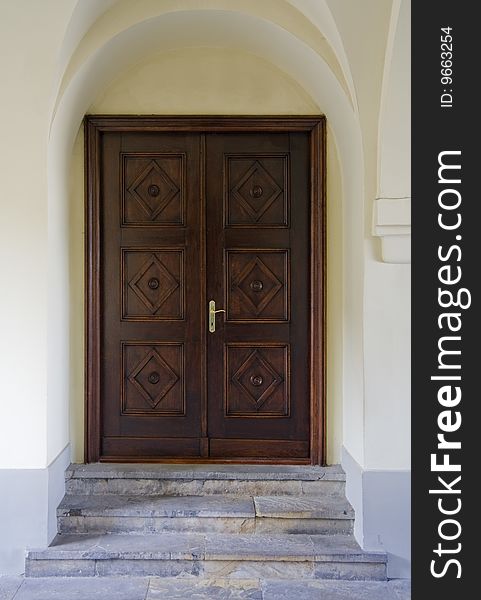 Beautiful panelled wood door with smooth plastered surround and stone steps. Beautiful panelled wood door with smooth plastered surround and stone steps