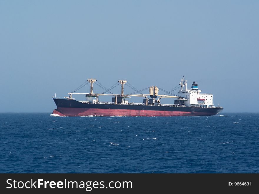 Cargo shipcrossing Tiran strait. Red sea.