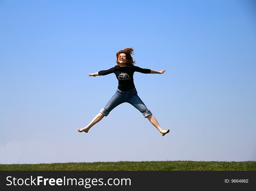 The girl taken in a jump like hanging in the air. The girl taken in a jump like hanging in the air