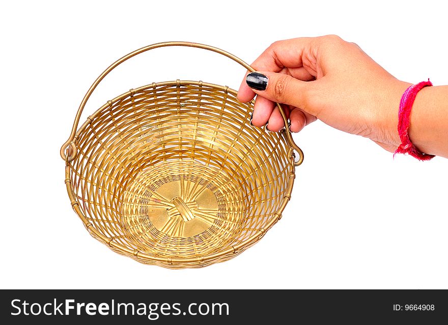 Female hand holding basket isolated on white background.