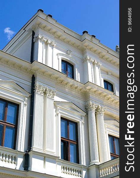 White building on blue sky background