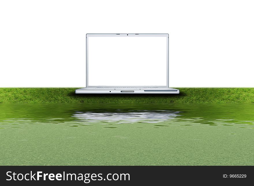 Blank Laptop Computer On The Green Grass