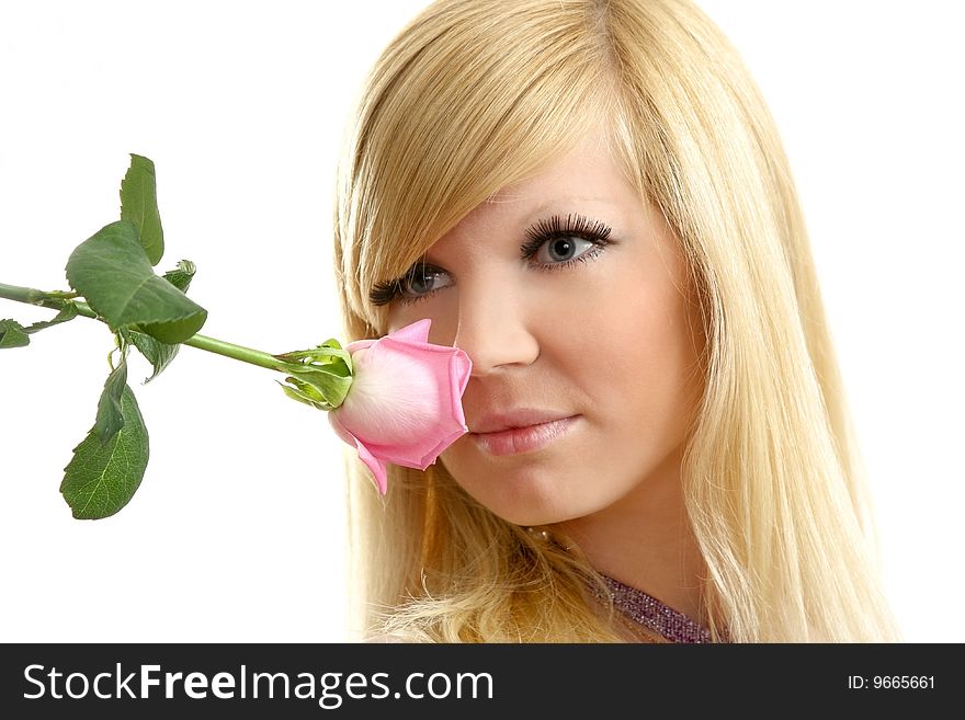 The beautiful girl with a flowing hair and a rose