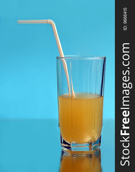A tall glass of orange juice
