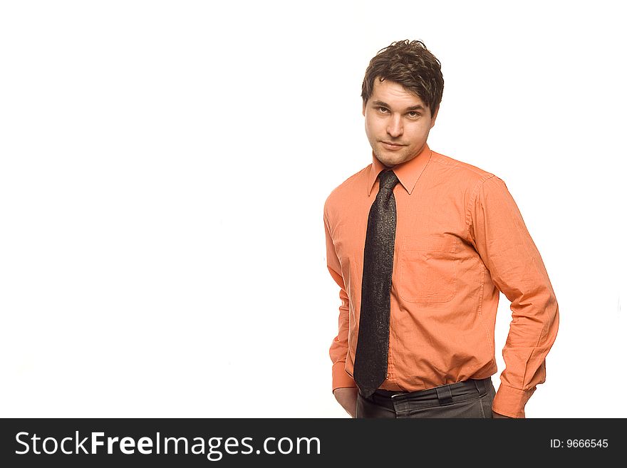 Young, good looking businessman standing in front of a white background. Young, good looking businessman standing in front of a white background