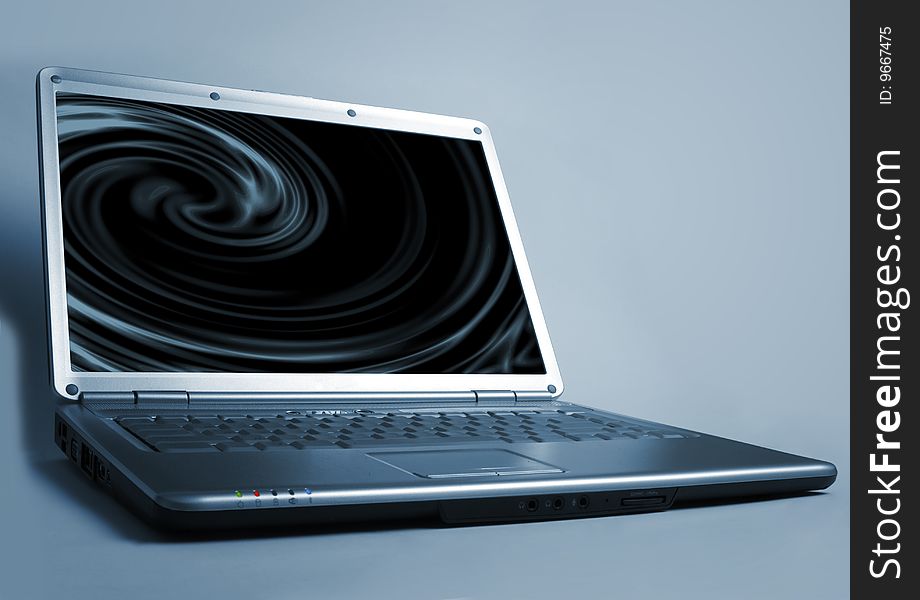 Futuristic laptop computer on dark background