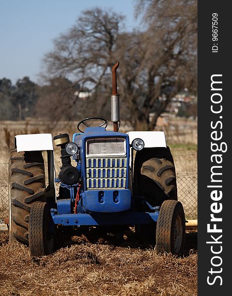 Blue tractor on a farm