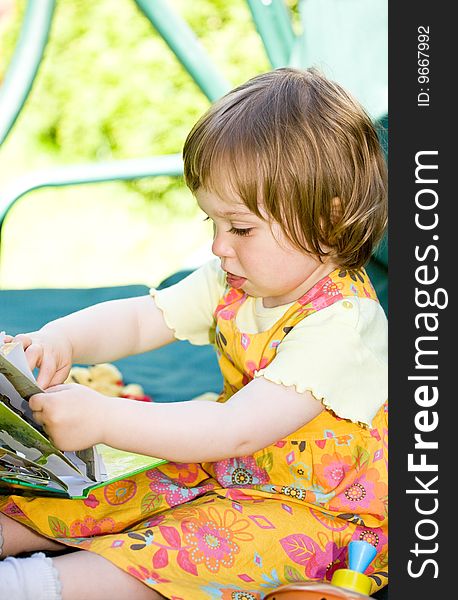 Toddler baby girl in garden. Toddler baby girl in garden