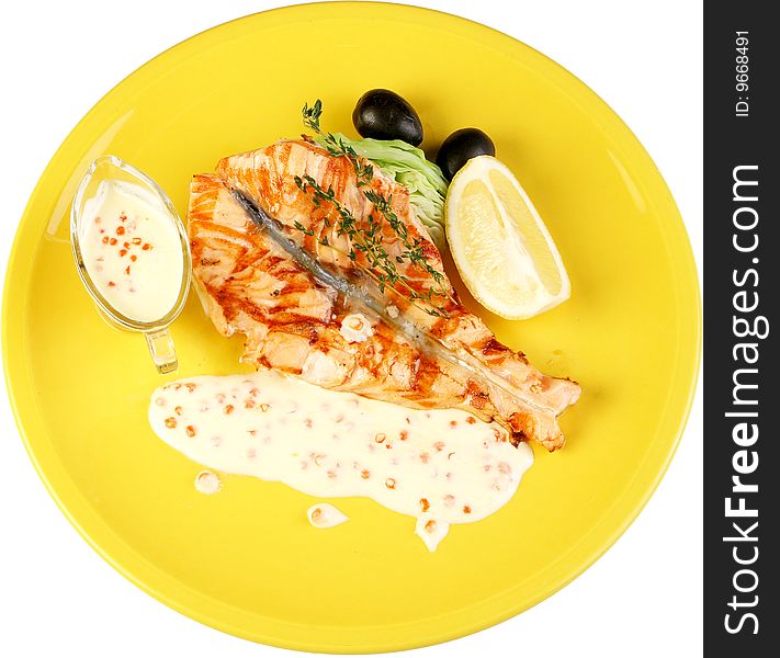 Fish the fried caviar is red in mayonnaise, a decoration is greenery and lemon