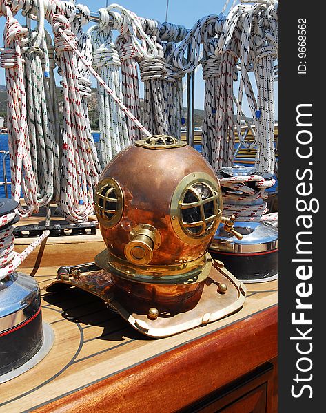 Antique diving mask on the boat deck