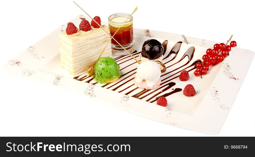 Cake of napoleon is an ice-cream, caramel, decoration of porichki and raspberry