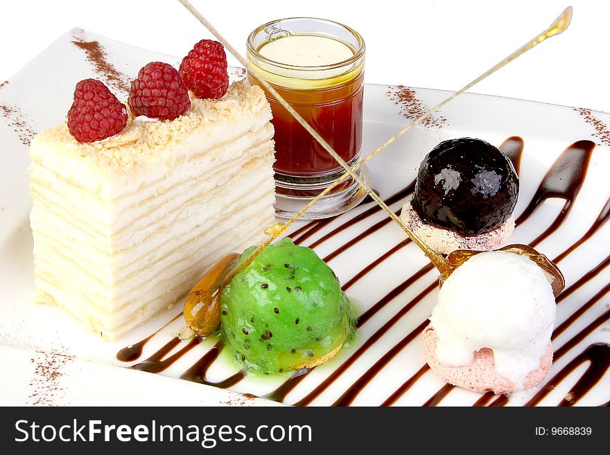 Cake of napoleon is an ice-cream, caramel, decoration of porichki and raspberry