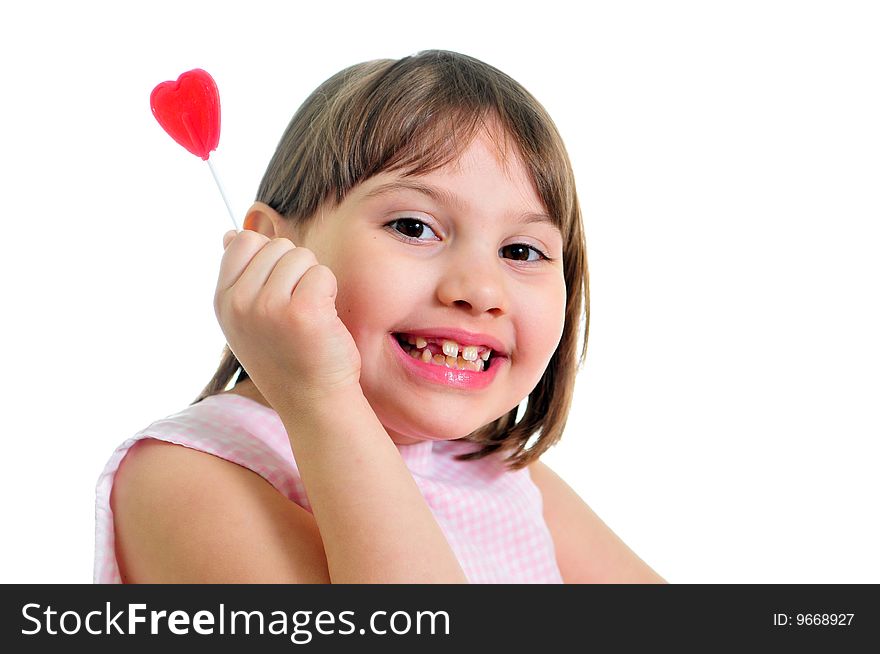Happy little girl with sweet isolated on the white background