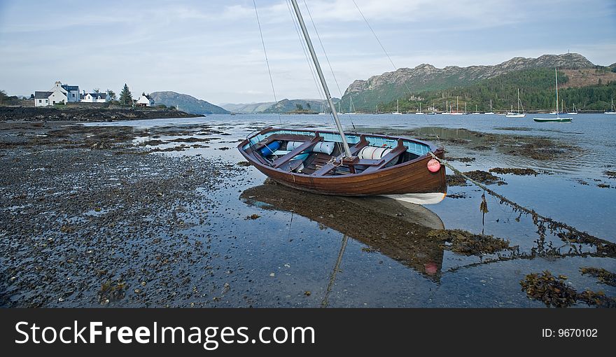 Image of a sailing boat moored at Plockton on the Scottish West Coast. Image of a sailing boat moored at Plockton on the Scottish West Coast..