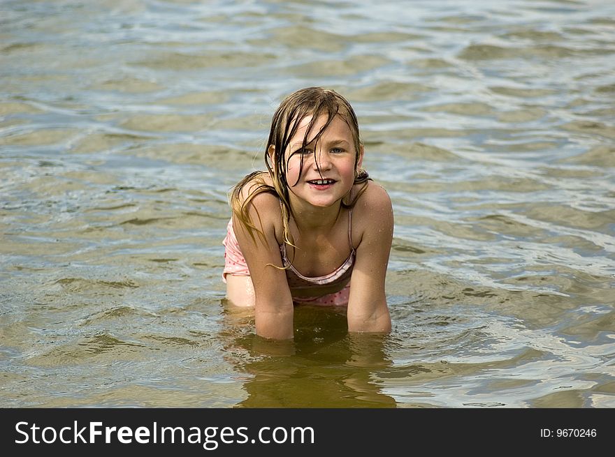 Little girl is playing and having fun in the water. Little girl is playing and having fun in the water
