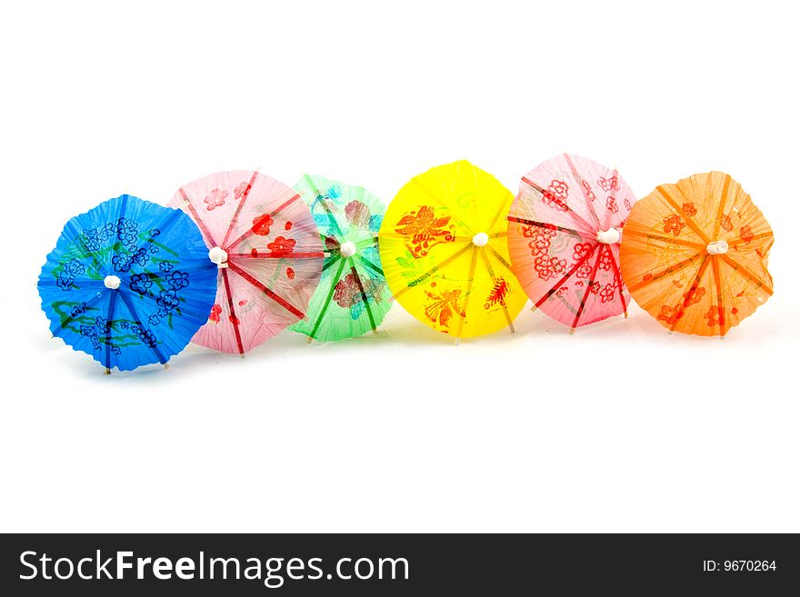 Colorful straw parasol isolated on a white background