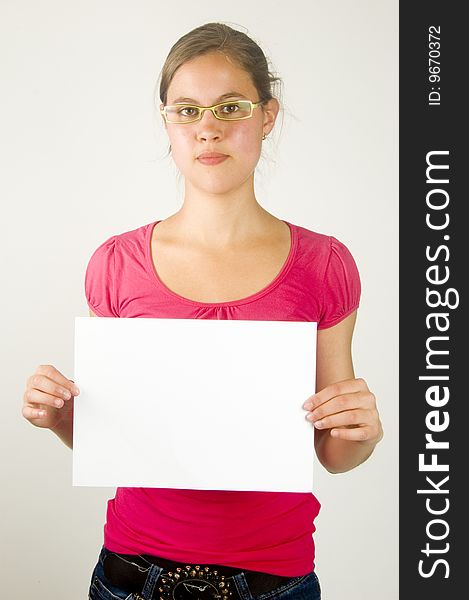 Beatiful young female is holding a white paper to write on. Beatiful young female is holding a white paper to write on