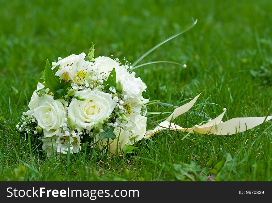 Wedding bouquet on green grass