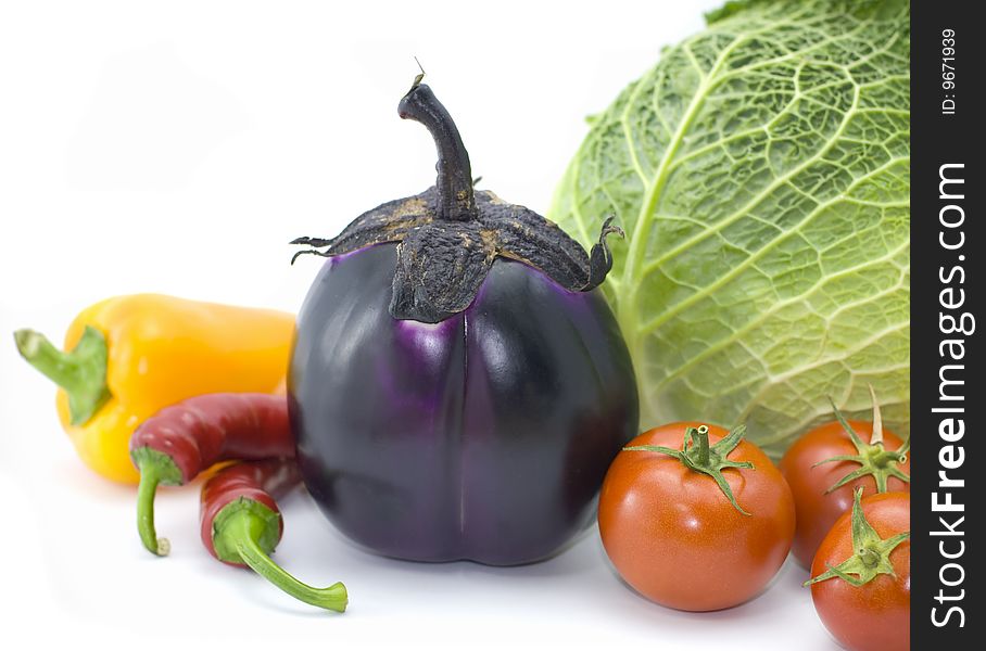 Cabbage, pepper, eggplant and tomatoes isolated on white background