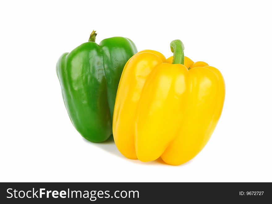 Two of brightly colored capsicums paprika isolated on white. Two of brightly colored capsicums paprika isolated on white.