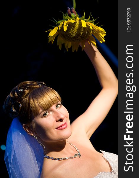 Bride with sunflower at night