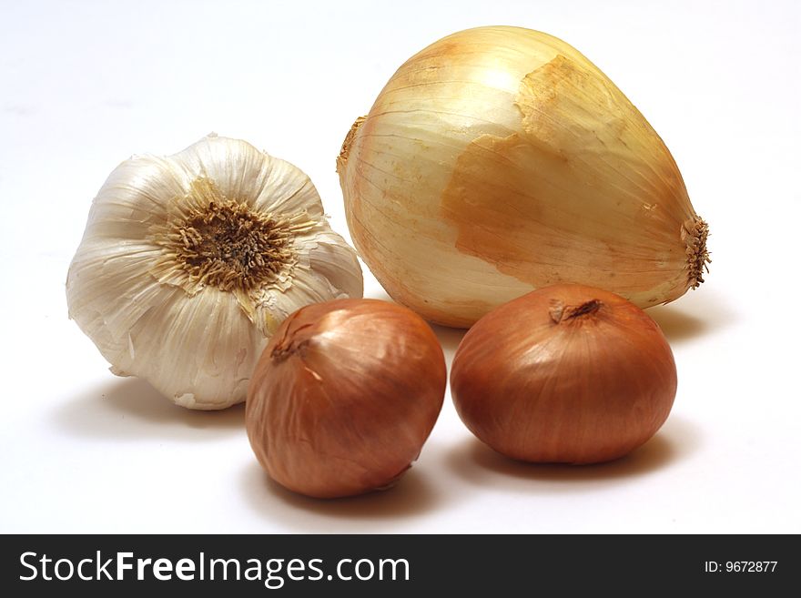 Onion, garlic and shallots on a white background