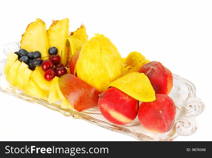Fruit plate with mango, cherry, blueberry and pineapples. Fruit plate with mango, cherry, blueberry and pineapples