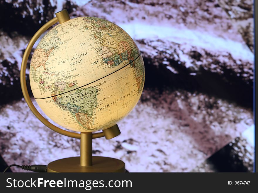A small globe on colorful background. A small globe on colorful background