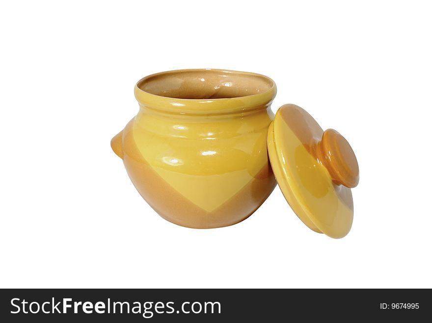 Clay, yellow pot with a cover, located on the isolated white background. Clay, yellow pot with a cover, located on the isolated white background