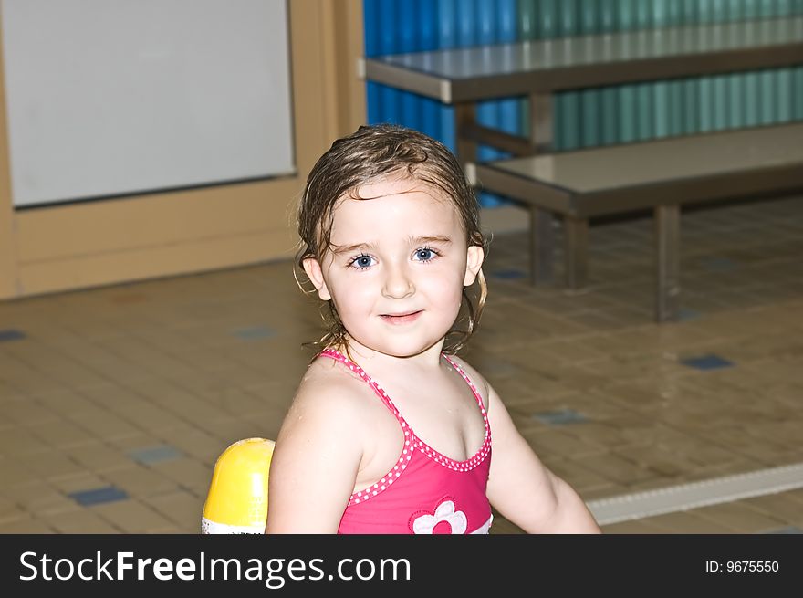 Photo of 4 years old girl in swimming pool