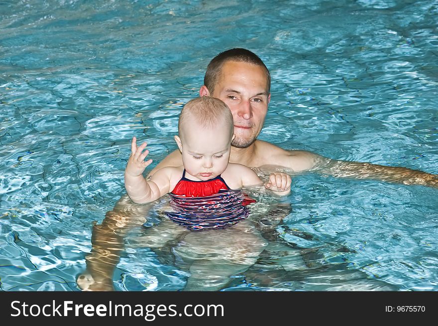 Father with little daughter in swimming pool. Father with little daughter in swimming pool