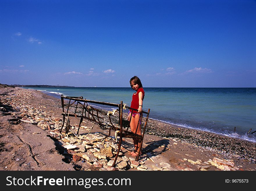 Girl playing near balck sea