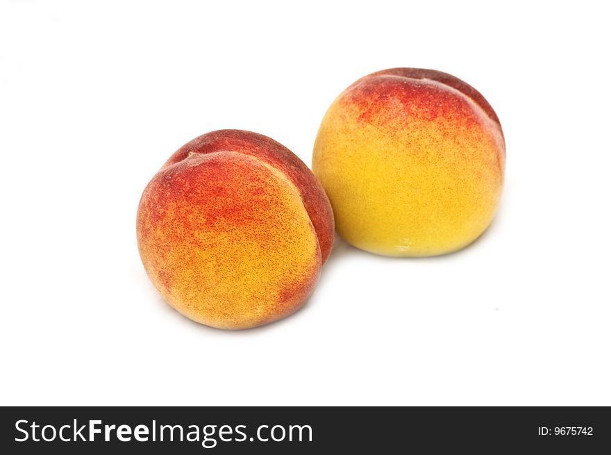 Photo of two isolated peaches