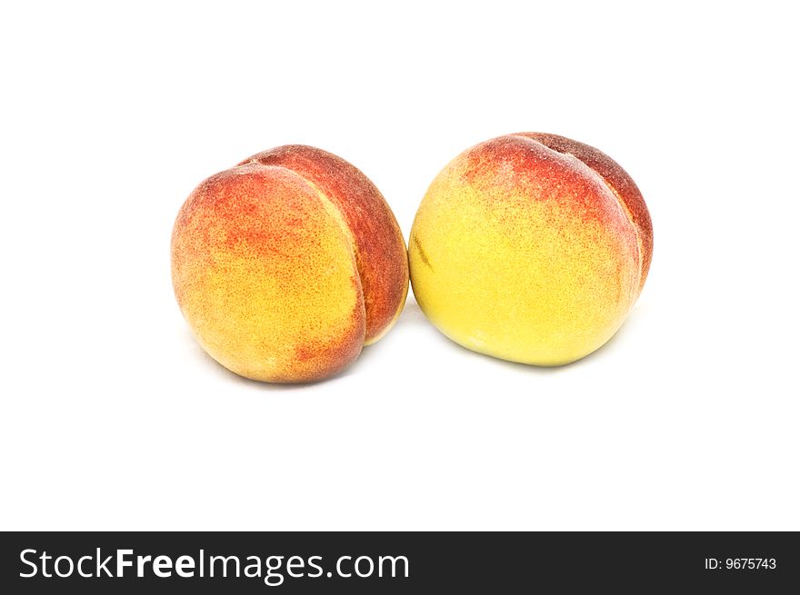 Photo of two sweet isolated peaches. Photo of two sweet isolated peaches
