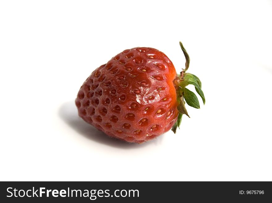 One isolated strawberry on a white background. One isolated strawberry on a white background