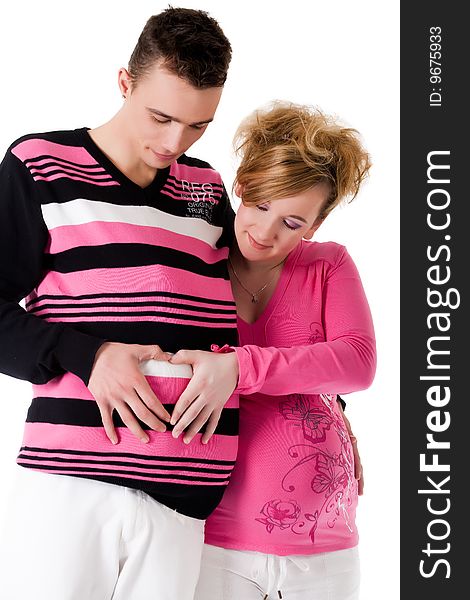 Young lovely caucasian couple expecting their baby. Young lovely caucasian couple expecting their baby