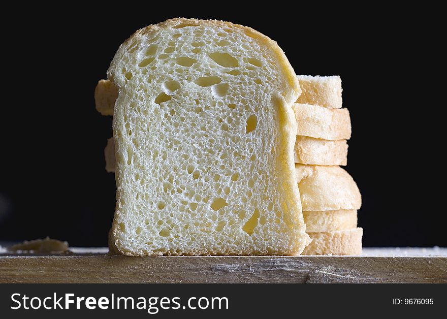 Close up of bread slices on a black background