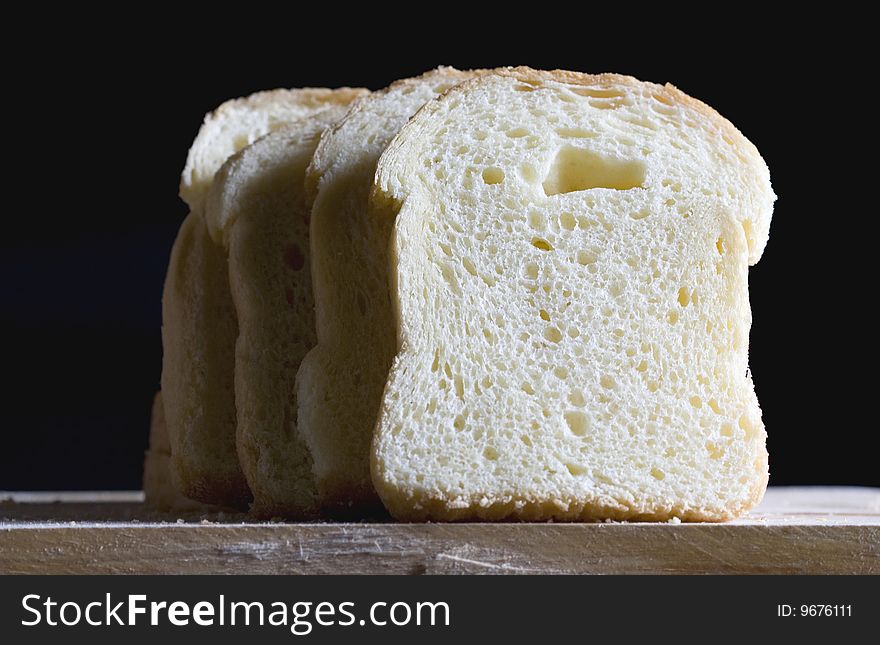 Close up of bread slices on a black background