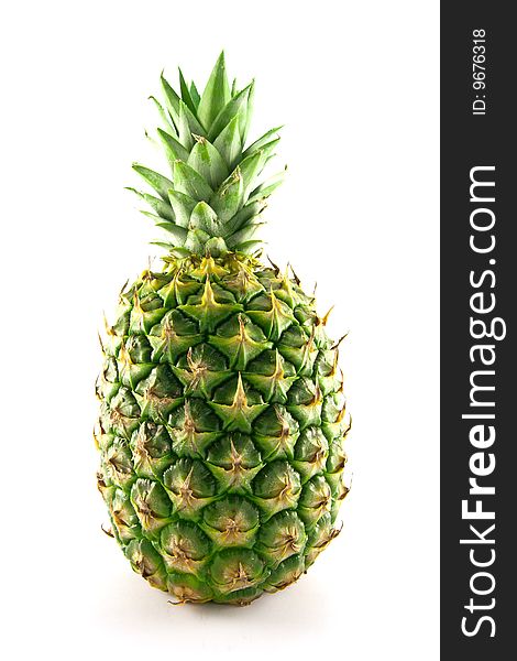 Fresh delicious looking green pineapple fruit on a white background with a clipping path. Fresh delicious looking green pineapple fruit on a white background with a clipping path