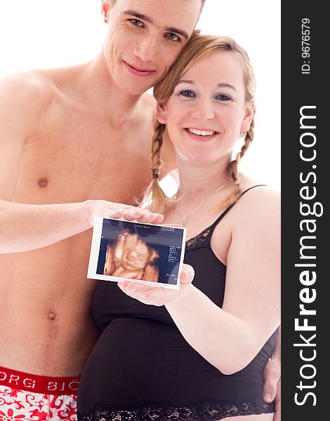 Young lovely caucasian couple expecting their baby. Young lovely caucasian couple expecting their baby