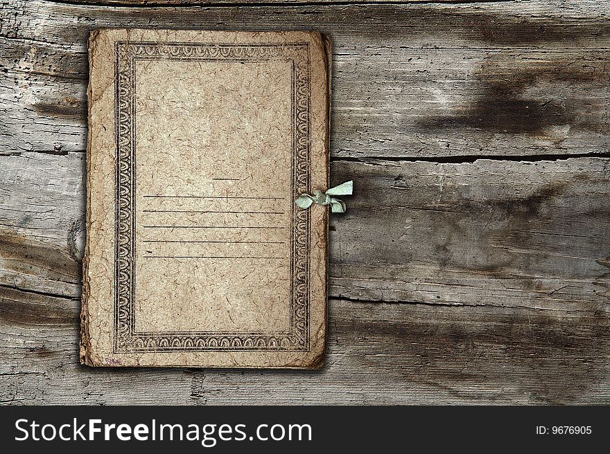 Old folder isolated on old wooden background