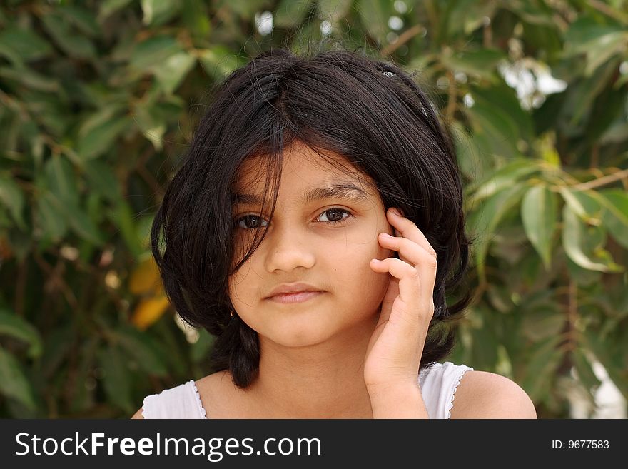 A small Indian girl with a soft and nice face. A small Indian girl with a soft and nice face.