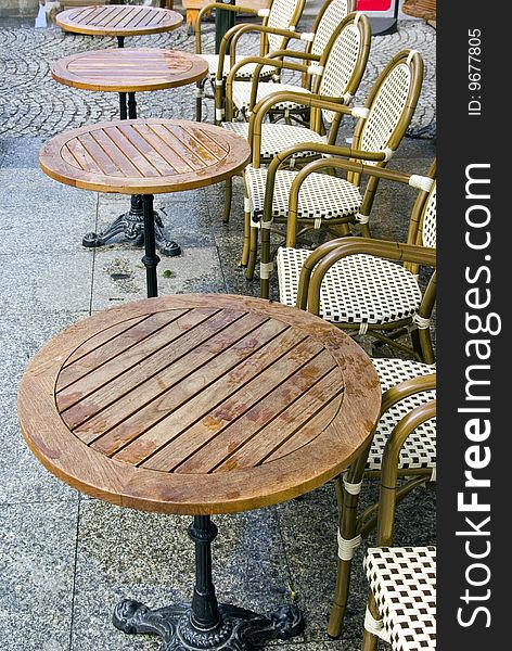 Rain and cafe tables