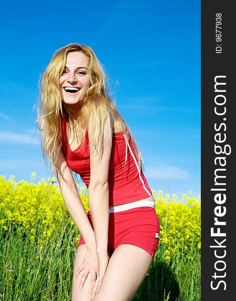 An image of woman in red sports suit outdoors. An image of woman in red sports suit outdoors