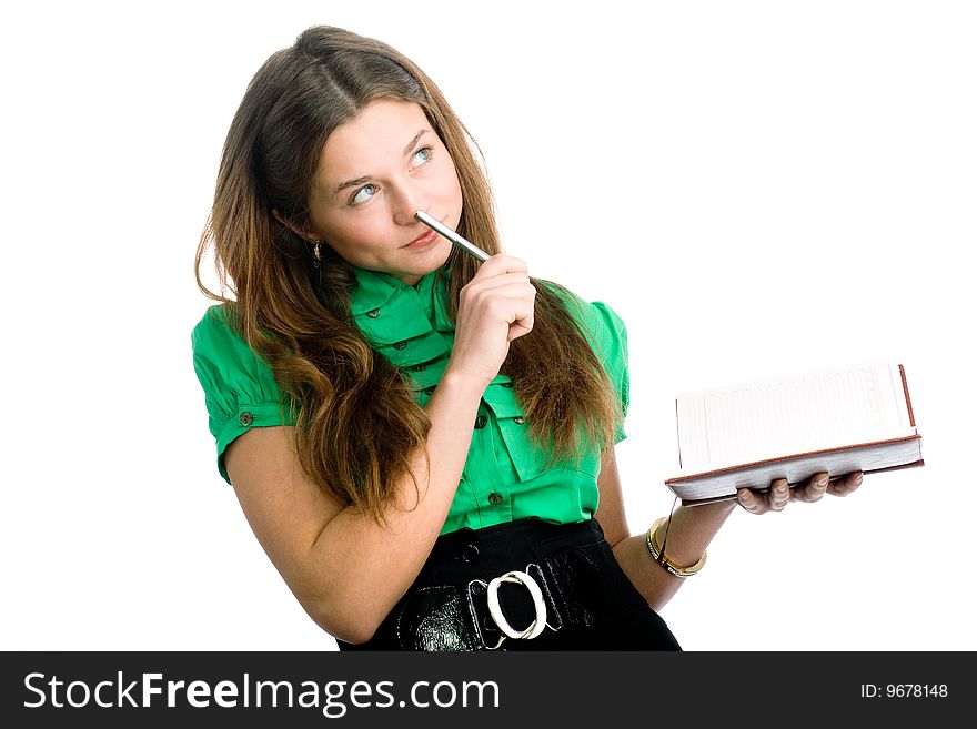 A graceful female student with a pen and a copybook in her hands